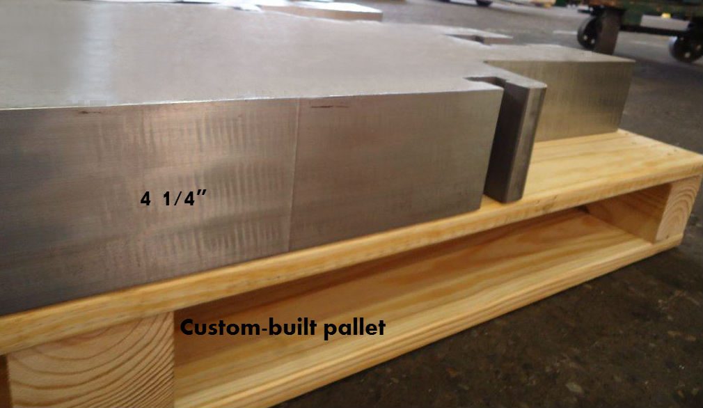 Close-up view of a precision-machined 4 1/4" thick gate valve component on a custom-built pallet, highlighting Sandmeyer Steel’s attention to detail.