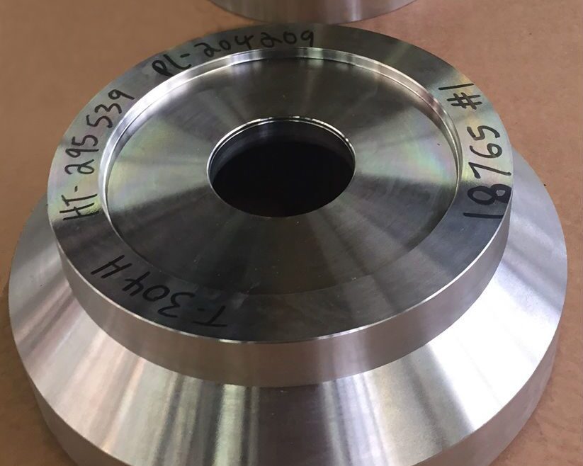 Custom-machined components produced through a multi-step process featuring precision milling and beveling.