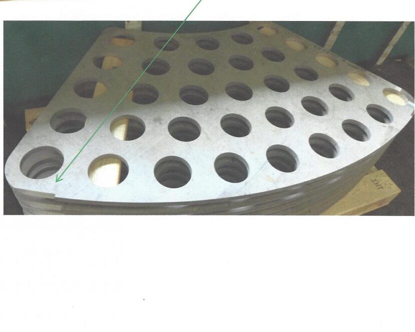 Stainless steel paddle with 35 evenly spaced large circular holes, made from 3/4” thick 316L stainless steel. The part has two double beveled edges, showcasing Sandmeyer Steel’s precise cutting and beveling capabilities