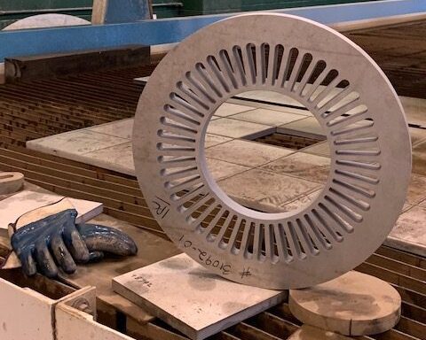 Precision waterjet-cut stainless steel ring with 48 evenly spaced slots, cut from 1.125” thick 347 Stainless Steel using Sandmeyer Steel’s Jet Edge 5-Axis Waterjet.